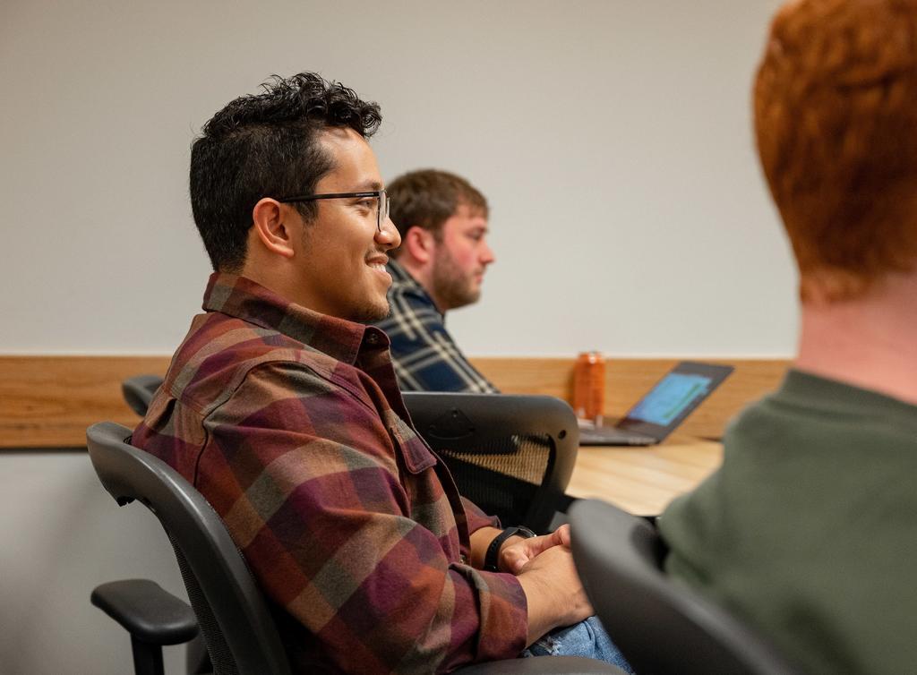 Schar School graduate student smiling in classroom